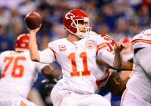 Jan 4, 2014; Indianapolis, IN, USA; Kansas City Chiefs quarterback Alex Smith (11) throws a pass during the 2013 AFC wild card playoff football game against the Colts at Lucas Oil Stadium.  Credit: Andrew Weber-USA TODAY Sports