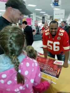 April 30, 2013; Fort Leavenworth, KS.; Chiefs linebacker Derrick Johnson (56) greeting fans at the Post Exchange during the team's visit as part of the Salute to Service program.