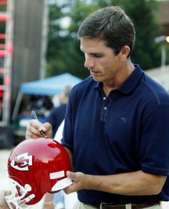 August 4, 2012; Canton, OH, USA; Kansas City Chiefs former quarterback Trent Green signs an autograph for a fan during the 2012 Pro Football Hall of Fame enshrinement ceremonies at Fawcett Stadium. Mandatory Credit: Charles LeClaire-USA TODAY Sports