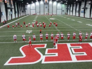 May 24, 2014; Kansas City, MO; General view of players warming up on Day One of Chiefs rookie minicamp at the team's indoor practice facility. Credit: Teope