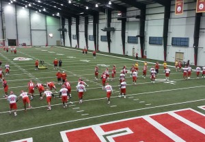 June 5, 2014; Kansas City, MO; General view of Chiefs players warming up for OTAs inside the team's training facility. Credit: Teope