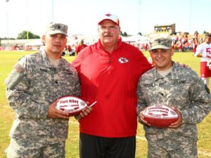 Aug. 14, 2014; St. Joseph, MO; Chiefs coach Andy Reid poses with Spc. Josh Rubio (left) and Spc. Jason Ortega (right) after practice. Photo used with permission by Chiefs PR. Credit: KCChiefs.com. 