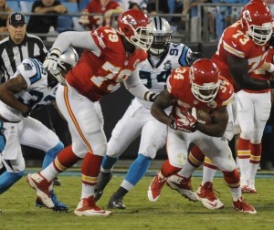 Aug 17, 2014; Charlotte, NC; Chiefs RT Donald Stephenson (79) blocks while RB Knile Davis (34) runs the ball during a preseason game against the Panthers at Bank of America Stadium. Credit: Sam Sharpe-USA TODAY Sports
