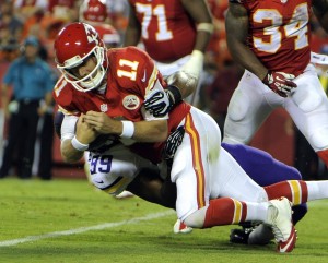 Aug 23, 2014; Kansas City, MO; Vikings defensive tackle Corey Wootton (99) sacks Chiefs quarterback Alex Smith (11) at Arrowhead Stadium. Credit: John Rieger-USA TODAY Sports 