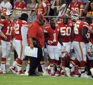 Aug 7, 2014; Kansas City, MO; Chiefs running back De'Anthony Thomas (1) is congratulated by coach Andy Reid after returning a punt for a touchdown against the Cincinnati Bengals at Arrowhead Stadium. Credit: John Rieger-USA TODAY Sports