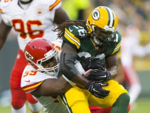 Aug 28, 2014; Green Bay, WI; Chiefs defensive tackle Vance Walker (99) takes down Packers running back DuJuan Harris (26) at Lambeau Field. Credit: Jeff Hanisch-USA TODAY Sports
