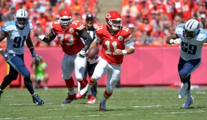  Sep 7, 2014; Kansas City, MO; Chiefs quarterback Alex Smith (11) runs the ball during the first half against the Tennessee Titans at Arrowhead Stadium. Credit: Denny Medley-USA TODAY Sports 