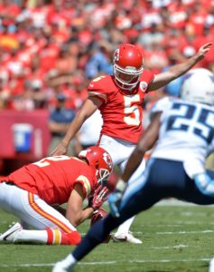 Sep 7, 2014; Kansas City, MO; Chiefs kicker Cairo Santos (5) attempts a field goal with punter Dustin Colquitt (2) holding against the Titans at Arrowhead Stadium. Credit: Denny Medley-USA TODAY Sports