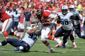Sep 7, 2014; Kansas City, MO; Titans defensive end Karl Klug (97) sacks Chiefs quarterback Alex Smith (11) in the second half at Arrowhead Stadium. Credit: John Rieger-USA TODAY Sports