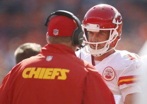 Sep 14, 2014; Denver, CO; Chiefs quarterback Alex Smith (11) talks with coach Andy Reid during the first half against the Denver Broncos at Sports Authority Field at Mile High. Credit: Chris Humphreys-USA TODAY Sports