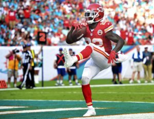Sep 21, 2014; Miami Gardens, FL; Chiefs running back Joe McKnight (22) scores a touchdown against the Miami Dolphins at Sun Life Stadium. Credit: Brad Barr-USA TODAY Sports