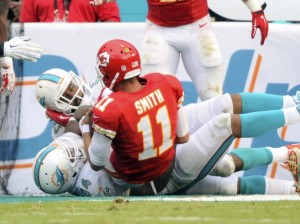 Sep 21, 2014; Miami Gardens, FL, USA; Dolphins defensive tackle Randy Starks (94) and linebacker Jelani Jenkins (53) sack Chiefs quarterback Alex Smith (11) in the end zone for a safety at Miami Sun Life Stadium. Credit: Brad Barr-USA TODAY Sports