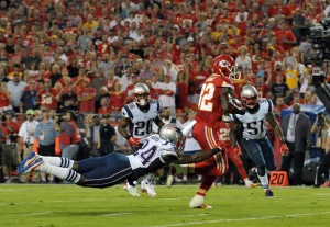 Sep 29, 2014; Kansas City, MO; Chiefs wide receiver Dwayne Bowe (82) catches a pass as Patriots cornerback Darrelle Revis (24) attempts the tackle at Arrowhead Stadium. Credit: Denny Medley-USA TODAY Sports