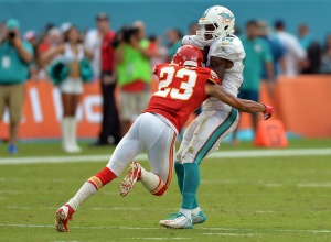 Sep 21, 2014; Miami Gardens, FL; Chiefs cornerback Phillip Gaines (23) tackles Miami Dolphins wide receiver Jarvis Landry (14) on a punt return at Sun Life Stadium. Credit: Steve Mitchell-USA TODAY Sports