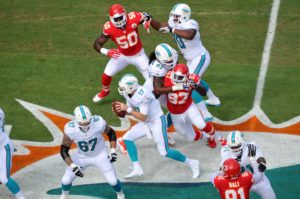 Sep 21, 2014; Miami Gardens, FL; Chiefs defensive end Allen Bailey (97) helps collapse the pocket on Miami Dolphins quarterback Ryan Tannehill (17) as linebackers Justin Houston (50) and Tamba Hali (91) provide outside pressure at Sun Life Stadium. Credit: Brad Barr-USA TODAY Sports