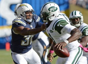 Oct 5, 2014; San Diego; New York Jets quarterback Michael Vick (1) attempts to get away from San Diego Chargers safety Marcus Gilchrist (38) at Qualcomm Stadium. Credit: Jayne Kamin-Oncea-USA TODAY Sports