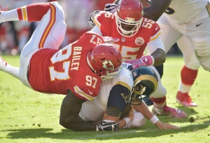 Oct 26, 2014; Kansas City, MO; Rams quarterback Austin Davis (9) is sacked by Chiefs linebacker Dee Ford (55) and defensive end Allen Bailey (97) during the second half at Arrowhead Stadium. Credit: Denny Medley-USA TODAY Sports