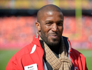 Nov 2, 2014; Kansas City, MO; Former Chiefs running back Priest Holmes on the sidelines before the game against the New York Jets at Arrowhead Stadium. Credit: Denny Medley-USA TODAY Sports