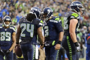 Nov 9, 2014; Seattle; Seahawks running back Marshawn Lynch (24) and quarterback Russell Wilson (3) celebrate after a touchdown against the New York Giants at CenturyLink Field. Credit: Steven Bisig-USA TODAY Sports