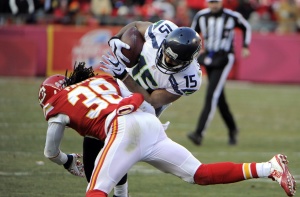 Nov 16, 2014; Kansas City, MO; Chiefs defensive back Ron Parker (38) tackles Seattle Seahawks wide receiver Jermaine Kearse (15) at Arrowhead Stadium. Credit: John Rieger-USA TODAY Sports