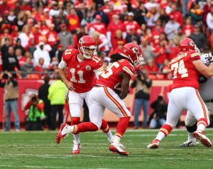 Dec. 14, 2014; Kansas City, MO; Chiefs G Jeff Linkenbach (74) blocks as QB Alex Smith (11) hands off to RB Jamaal Charles (25). Photo used with permission from Chiefs PR. Credit: KCChiefs.com