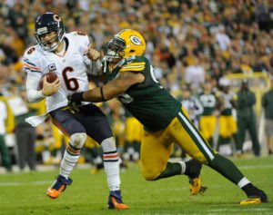 Sept 13, 2012; Green Bay, WI; Then-Packers defensive tackle Jerel Worthy (99) sacks Chicago Bears quarterback Jay Cutler (6) at Lambeau Field. Credit: Benny Sieu-USA TODAY Sports
