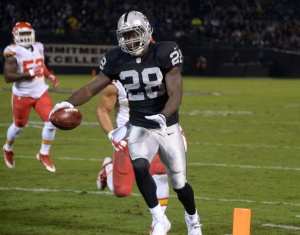 Nov 20, 2014; Oakland, CA; Raiders running back Latavius Murray (28) scores on an 11-yard touchdown run in the first quarter against the Chiefs at O.co Coliseum. Credit: Kirby Lee-USA TODAY Sports
