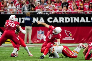 Dec. 7, 2014; Glendale, AZ, USA; Chiefs outside linebacker Tamba Hali (91) hits Cardinals quarterback Drew Stanton (5) low, resulting in a 15-yard penalty for roughing the passer. Credit: Matt Kartozian-USA TODAY Sports