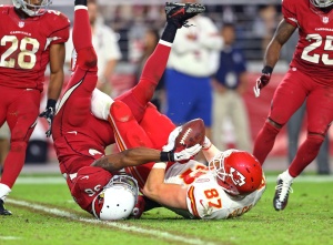 Dec 7, 2014; Glendale, AZ; Cardinals safety Deone Bucannon (36) forces a controversial fourth-quarter fumble on Chiefs tight end Travis Kelce (87) at University of Phoenix Stadium. Mandatory Credit: Mark J. Rebilas-USA TODAY Sports