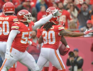 Dec 14, 2014; Kansas City, MO, USA; Chiefs linebacker Dee Ford (55) and cornerback Jamell Fleming (30) celebrate after a play in Week 15 at Arrowhead Stadium. Credit: Denny Medley-USA TODAY Sports