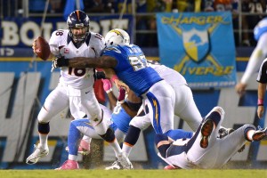 Oct 15, 2012; San Diego; Then-Chargers defensive end Vaughn Martin (92) pressures Broncos quarterback Peyton Manning (18) at Qualcomm Stadium. redit: Jake Roth-USA TODAY Sports