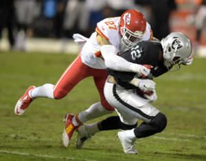 Nov 20, 2014; Oakland, CA; Chiefs safety Kurt Coleman (27) tackles Raiders receiver Brice Butler (12) at O.co Coliseum. Credit: Kirby Lee-USA TODAY Sports