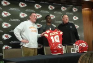 March 11, 2015; Kansas City, MO; Wide receiver Jeremy Maclin, flanked by GM John Dorsey and coach Andy Reid, meets the media after signing with the Chiefs. Credit: Teope