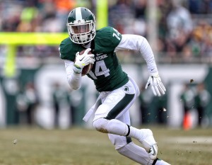 Nov 22, 2014; East Lansing, MI; Michigan State Spartans wide receiver Tony Lippett (14) runs with the ball after a catch at Spartan Stadium. Credit: Mike Carter-USA TODAY Sports