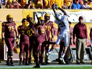 Oct 19, 2013; Tempe, AZ; Washington defensive back Marcus Peters (21) intercepts a pass intended for Arizona State Sun Devils wide receiver Jaelen Strong (21) during the first half at Sun Devil Stadium. Credit: Matt Kartozian-USA TODAY Sports
