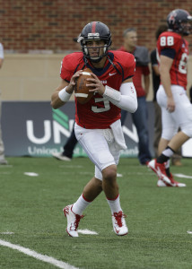 Richmond quarterback Michael Strauss (3) looks to toss a pass during warmups  prior to the start of the Maine Richmond NCAA college football game in Richmond, Va., Saturday, Sept. 28, 2013.    (AP Photo/Steve Helber)