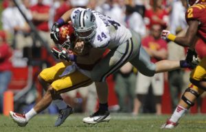 Iowa State quarterback Sam B. Richardson (12) is wrapped up by Kansas State defensive end Ryan Mueller (44) during the second half of an NCAA college football game Saturday, Sept. 6, 2014, in Ames, Iowa. Kansas State won 32-28. (AP Photo/Justin Hayworth)