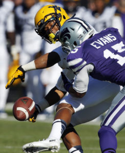 Kansas State defensive back Randall Evans, right, knocks the ball away from West Virginia wide receiver Daikiel Shorts during the first half of an NCAA college football game in Manhattan, Kan., Saturday, Oct. 26, 2013. (AP Photo/Orlin Wagner)