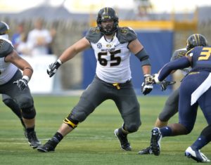 Missouri Tigers offensive linesman Mitch Morse (65) lines up in the first quarter of a 49-24 win over the Toledo Rockets in an NCAA college football game in Toledo, Ohio, Saturday, Sept. 6, 2014. (AP Photo/David Richard)
