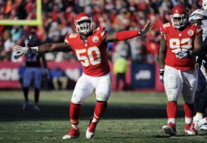 Kansas City Chiefs outside linebacker Justin Houston (50) celebrates a sacking of San Diego Chargers quarterback Philip Rivers with Chiefs nose tackle Dontari Poe (92) looking on during the first half of an NFL football game in Kansas City, Mo., Sunday, Dec. 28, 2014. (AP Photo/Ed Zurga)