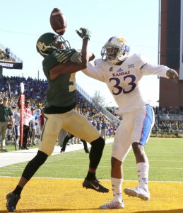 Kansas safety Cassius Sendish (33) breaks up the pass intended for Baylor wide receiver KD Cannon in the first half of an NCAA college football game, Saturday, Nov. 1, 2014, in Waco, Texas. (AP Photo/ Jerry Larson)