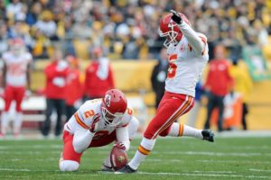 Kansas City Chiefs kicker Cairo Santos (5) boots a field goal out of the hold of punter Dustin Colquitt (2) during the first half of an NFL football game against the Pittsburgh Steelers in Pittsburgh, Sunday, Dec. 21, 2014. (AP Photo/Don Wright)