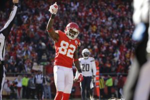 Kansas City Chiefs wide receiver Dwayne Bowe (82) celebrates a touchdown by teammate Kansas City Chiefs tight end Travis Kelce ,during the first half of an NFL football game against the San Diego Chargers in Kansas City, Mo., Sunday, Dec. 28, 2014. (AP Photo/Charlie Riedel)