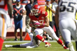 Kansas City Chiefs tight end Travis Kelce (87) avoids a tackle in the first half of an NFL football game against the St. Louis Rams at Arrowhead Stadium in Kansas City, Mo., Sunday, Oct. 26, 2014. (AP Photo/Colin E. Braley)