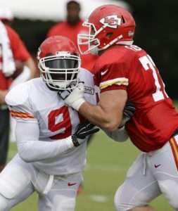 Aug. 4, 2015; St. Joseph, MO: Chiefs outside linebacker Tamba Hali (91) tries to get around tackle Eric Fisher (72) during drills at training camp. (AP Photo/Orlin Wagner)