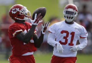 Aug. 1, 2015; St. Joseph, MO: Chiefs WR Jeremy Maclin (19) catches a deep pass as CB Marcus Cooper (31) trails on the first full-team practice of training camp. (AP Photo/Orlin Wagner)