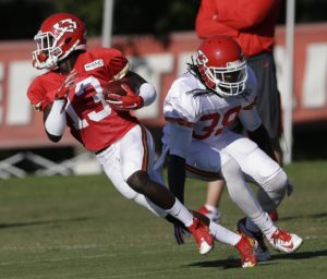 Aug. 11, 2015; St. Joseph, MO; Chiefs wide receiver De'Anthony Thomas (13) gets away from strong safety Ron Parker (38) during training camp. (AP Photo/Orlin Wagner)