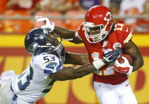 Aug. 21, 2015; Kansas City, MO; Chiefs rookie wide receiver Chris Conley (17) fights off Seahawks linebacker Tyrell Adams during preseason action at Arrowhead Stadium. (Chris Neal/The Topeka Capital-Journal)