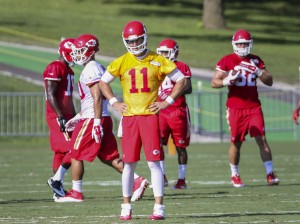 Aug. 2, 2014; St. Joseph, MO; Chiefs quarterback Alex Smith looks to the sidelines between plays after throwing an incompletion during training camp. (Emily DeShazer/The Topeka Capital-Journal)