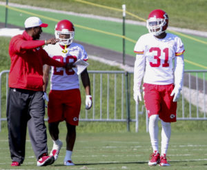 Aug. 2, 2015; St. Joseph, MO; Chiefs cornerbacks Marcus Cooper (31) and Steven Nelson (20) listen to defensive assistant/secondary coach Al Harris during training camp at Missouri Western State University. (Emily DeShazer/The Topeka Capital-Journal)